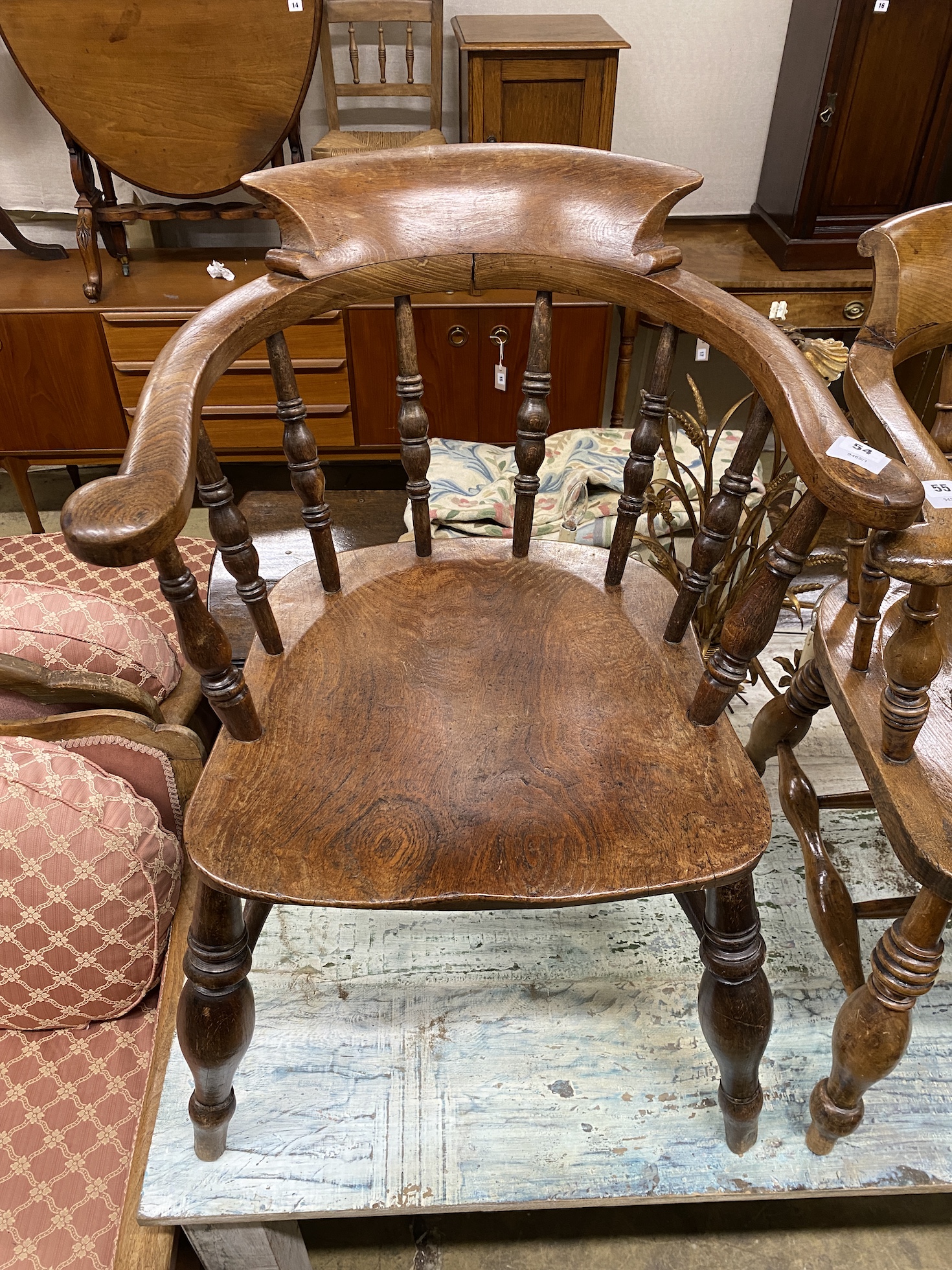 A Victorian elm and beech smoker's bow elbow chair, width 60cm, depth 49cm, height 84cm